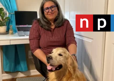 Woman sitting down with a dog. npr.