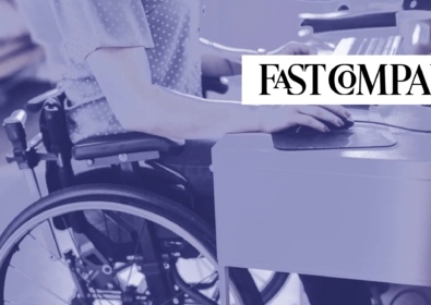 Person in a wheelchair working at a desk. Fast Company.