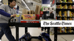 Man working at a warehouse. The Seattle Times.